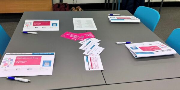 A picture of a table with CPD booklets, pens and flyers.